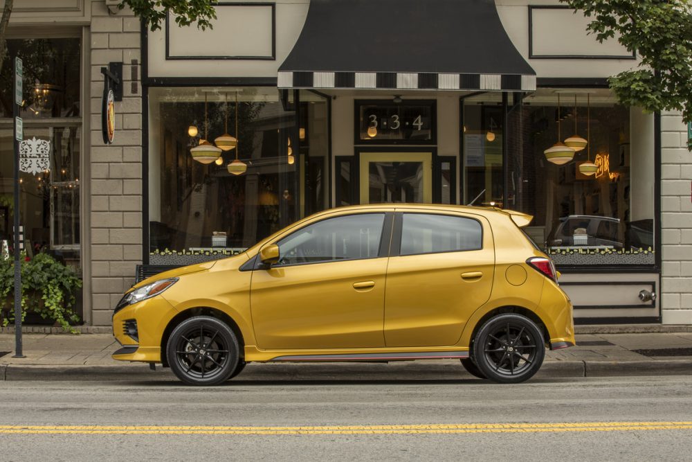 The 2021 Mitsubishi Mirage parked in front of a restaurant